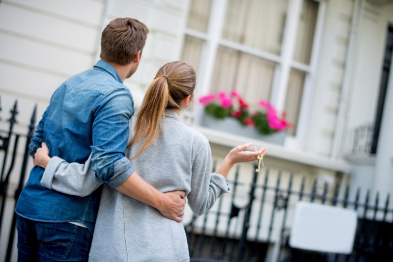 Couple holding house keys